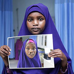 A girl holding a photo of herself. Read about Gifts of Life Insurance A girl holding a photo of herself. Read about Gifts of Life Insurance