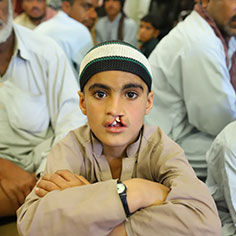 A boy looking into the camera. Read about Gifts That Protect Your Assets